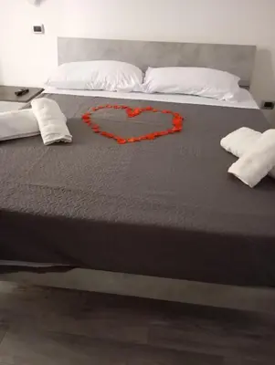 a bed with a heart drawn on it at Marisol in Palermo