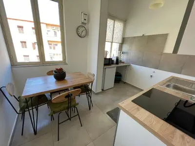 a kitchen and dining room with a table and chairs at Appartamento vicino il centro in Palermo