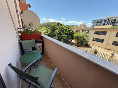 a balcony with two chairs and a mirror at Appartamento vicino il centro in Palermo