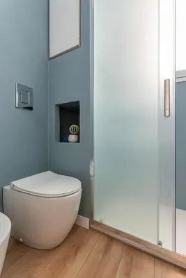 a bathroom with a toilet and a shower at Casetta al Molo di Mondello by Wonderful Italy in Palermo