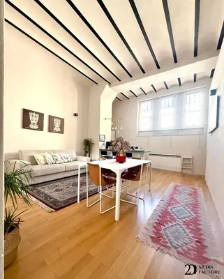 a living room with a table and a couch at Da Lila a Ballarò in Palermo