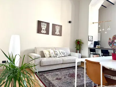 a living room with a couch and a table at Da Lila a Ballarò in Palermo