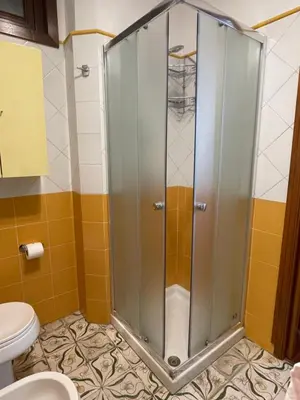 a shower in a bathroom with a toilet at Le Terrazze Élite Apartment in Palermo