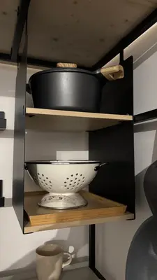 a shelf with a bowl and a pot on it at caZA' Capo 40MQ nel centro di Palermo in Palermo