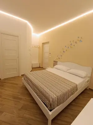 a bedroom with a bed with stars on the wall at Balarm Central Apartment in Palermo