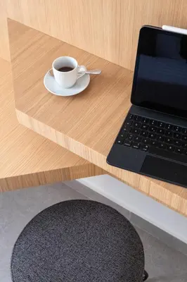 a cup of coffee sitting on a table next to a laptop at Cilea Apartments in Palermo