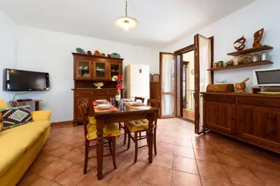 a living room with a table and a couch at I Tre Golfi - Pianeti in San Vito lo Capo