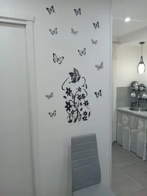 a kitchen with butterflies on the wall at Pietro Fudduni Apartment in Palermo