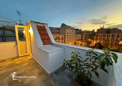 a staircase on a balcony with a view of the city at Mansarda Florio in Palermo