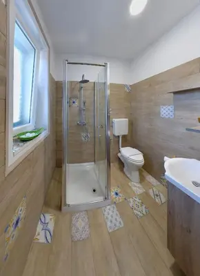 a bathroom with a shower and a toilet at Isola dei tesori - affittacamere palermo in Palermo