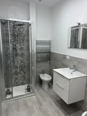 a bathroom with a shower and a sink and a toilet at Casa vacanze Giada in Terrasini