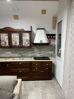 a kitchen with a sink and a stove top oven at Casa vacanze Giada in Terrasini