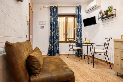 a living room with a couch and a table at Luxury House Ballarò in Palermo