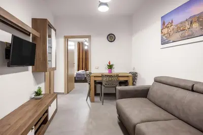 a living room with a couch and a table at G e B Central Apartment in Palermo