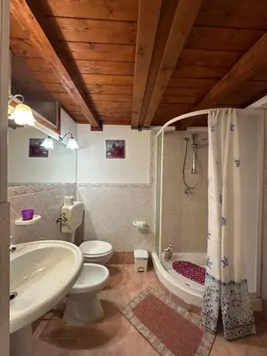 a bathroom with a tub and a toilet and a sink at B&B Salinas in Palermo