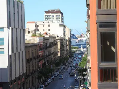 a view of a city street with cars and buildings at B&B Salinas in Palermo