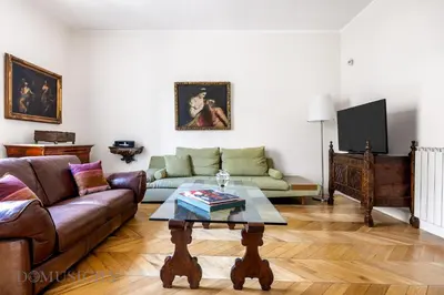 a living room with a couch and a coffee table at Elvi Penthouse by DomuSicily in Palermo