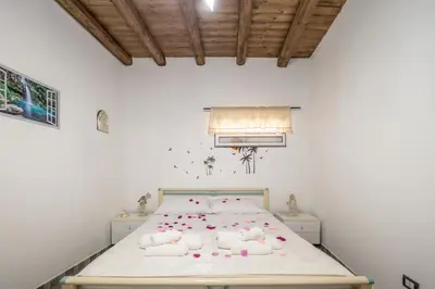 a bedroom with a bed with stuffed animals on it at La Casa di Sciù Sciù in Palermo