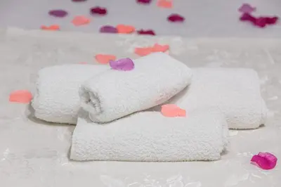 three towels with hearts on them on a table at La Casa di Sciù Sciù in Palermo