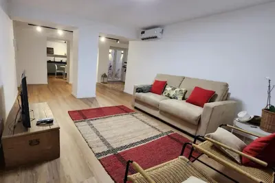 a living room with a couch and a rug at La Casa Di Mitì in Palermo