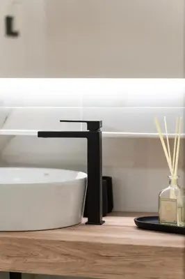 a bathroom sink sitting on a wooden counter with a sink at Ambrosia Suite in Palermo