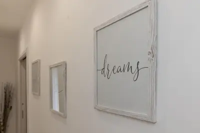 a picture frame with the word therapy on a wall at Ludo Holiday House - Charming con patio a due passi dalla cattedrale in Palermo