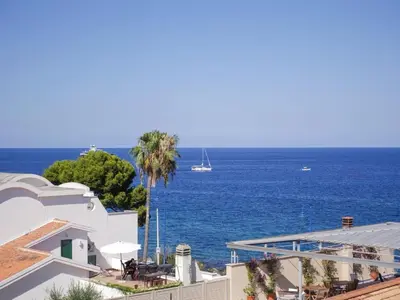 a view of the ocean from a building at Casa del pescatore - fronte mare di Mondello - By Rentalbeb italy- in Palermo