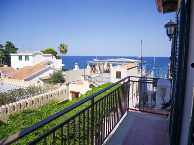 a balcony with a view of the ocean at Casa del pescatore - fronte mare di Mondello - By Rentalbeb italy- in Palermo
