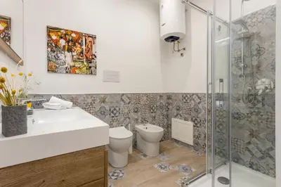 a bathroom with a sink and a shower at Old Port Luxury Apartments in Palermo