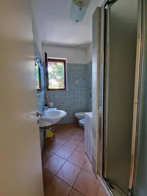 a bathroom with a sink and a toilet and a shower at Triskelia in San Vito lo Capo
