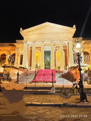 a large building with a red dress in front of it at Jujube hortus apartment 4 in Palermo
