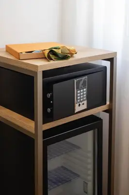 a wooden table with a microwave on top of it at Mondello Glam Hotel & Terrace in Mondello