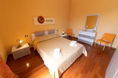 a bedroom with a bed with two towels on it at Stella Maris Case Vacanze in Balestrate