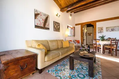 a living room with a couch and a table at La Terrazza di Massimo in Palermo