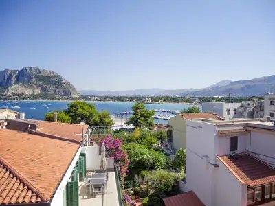 a view of the water from the roofs of buildings at Casa del pescatore Appartment -By Rentalbeb italy- in Palermo