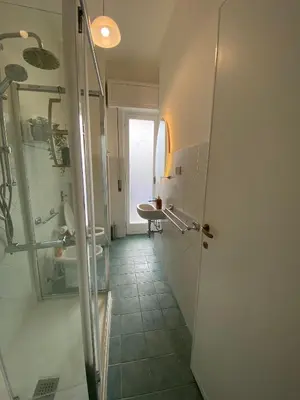 a bathroom with a shower and a toilet and a sink at Casa Verdura in Palermo