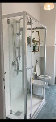 a bathroom with a shower and a toilet at Casa Verdura in Palermo
