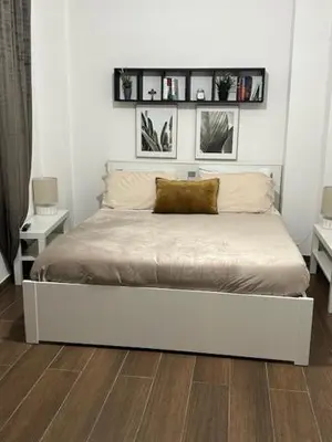 a bedroom with a bed with a pillow on it at Dedè Dream in Palermo