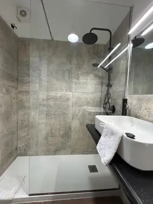 a bathroom with a sink and a shower at Dedè Dream in Palermo
