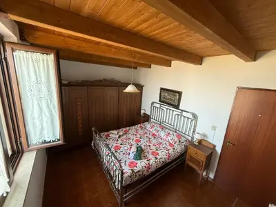 a bedroom with a bed and a window at Villa Shanti a Romitello - 