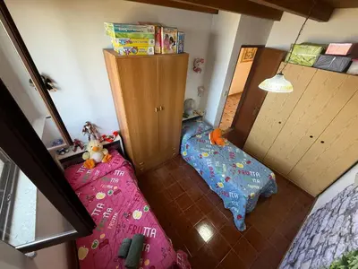 a small bedroom with a bed and a bunk bed at Villa Shanti a Romitello - 
