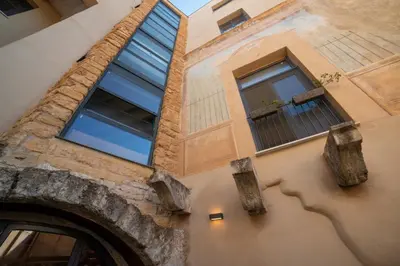 a building with two windows and a doorway at Boutique Apartment 