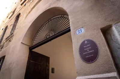 a entrance to a building with a sign above a door at Boutique Apartment 