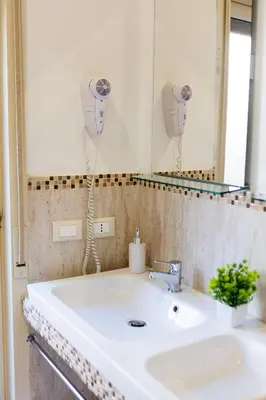 a bathroom with a sink and a mirror at Ai Mercati di Palermo in Palermo