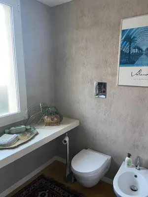 a bathroom with a toilet and a sink at marinellahomeandsea in Palermo