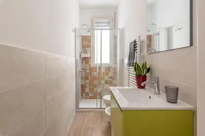 a bathroom with a sink and a shower at La Casetta Donna Vita a Mondello by Wonderful Italy in Palermo