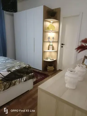 a bedroom with a bed and a table with towels at Suite 374 in Palermo