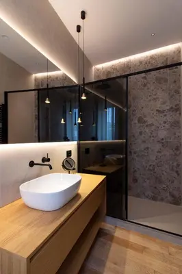 a bathroom with a large white sink and a shower at Lùlom - Rooftop Boutique Rooms in Palermo