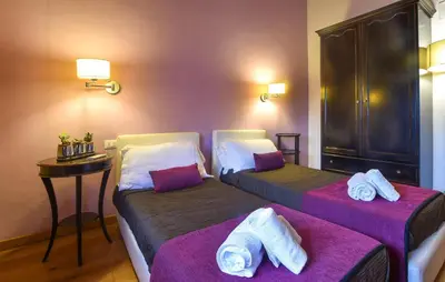 a hotel room with two beds with towels on them at Nice Home In Partinico With Wifi in Partinico