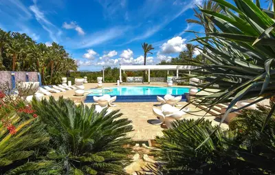 a swimming pool with lounge chairs and a resort at Nice Home In Partinico With Wifi in Partinico